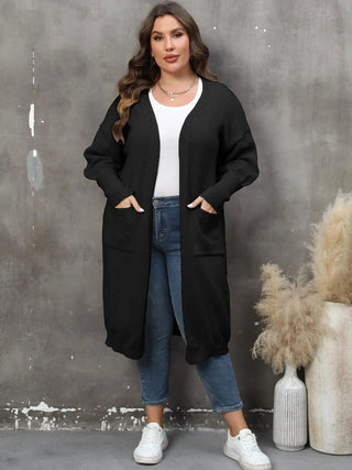 plus size long sleeve black pocketed cardigan with open front ribbed design worn over white top and blue jeans