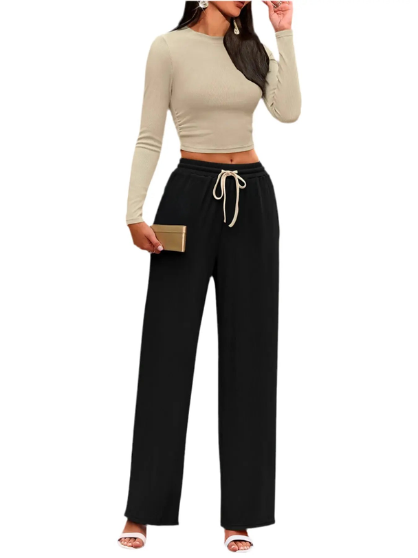woman wearing beige round neck long sleeve top and black drawstring pants set