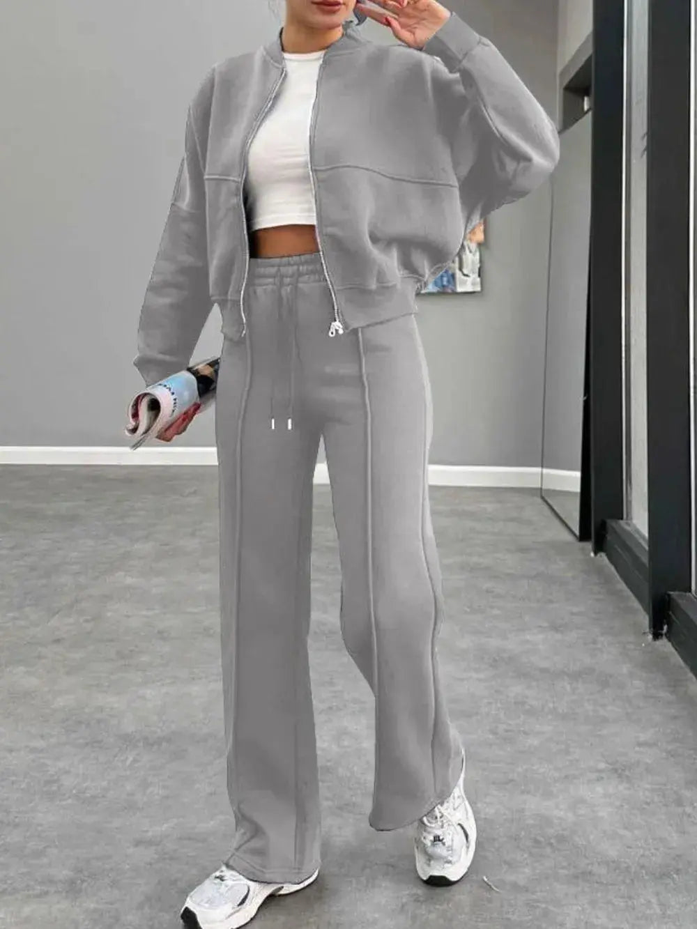 Gray baseball collar zip up outerwear and drawstring pants set for women with a sporty, casual style