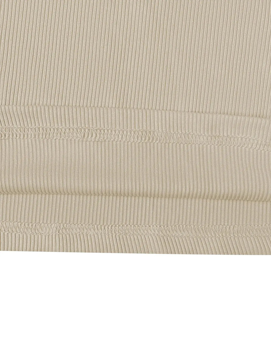 Beige ribbed fabric close-up of round neck long sleeve top and pants set made from soft polyester