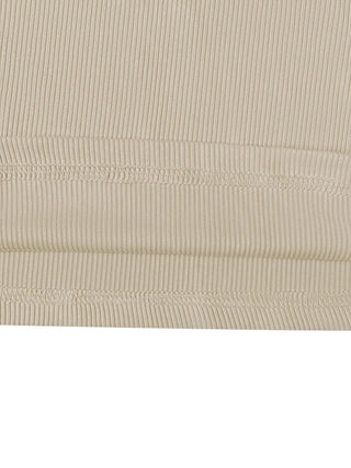 Beige ribbed fabric close-up of round neck long sleeve top and pants set made from soft polyester
