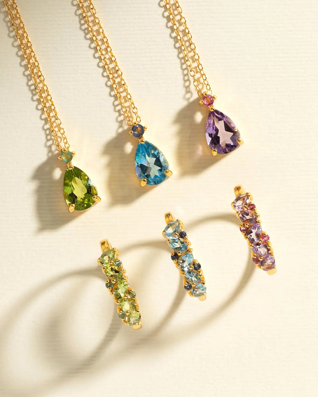 Blue sapphire and blue topaz pear cut pendant and matching gemstone earrings in gold vermeil settings