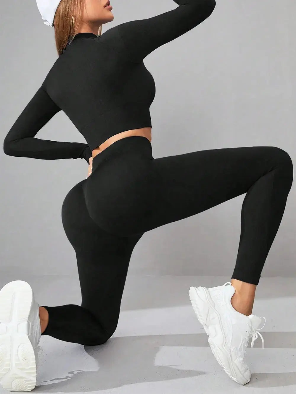 black mock neck long sleeve top and leggings active set with white sneakers