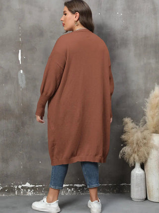 plus size long sleeve brown pocketed cardigan with ribbed detail and open front worn with jeans and sneakers
