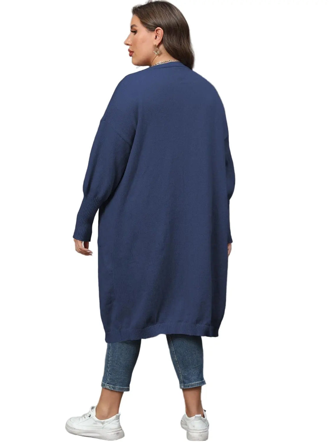 Plus size long sleeve navy pocketed cardigan back view worn with cropped jeans and white sneakers