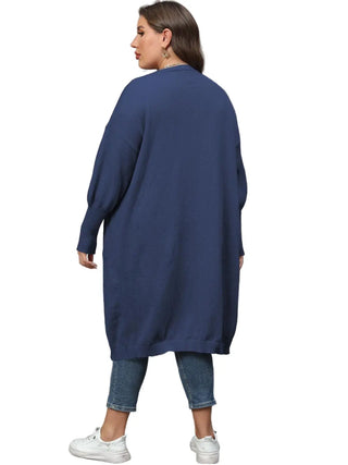 Plus size long sleeve navy pocketed cardigan back view worn with cropped jeans and white sneakers