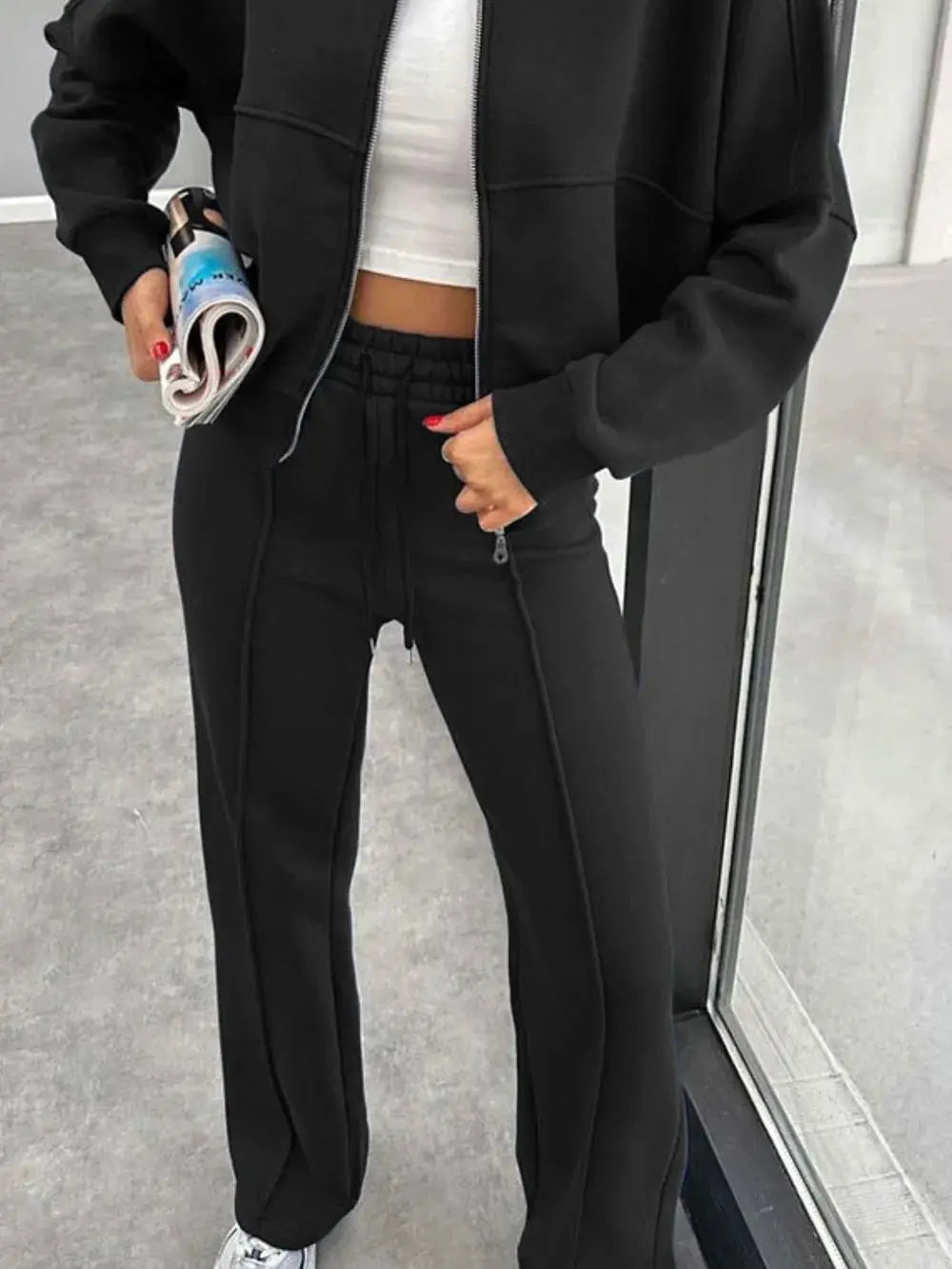 Black baseball collar zip up outerwear and drawstring pants set with a white inner top