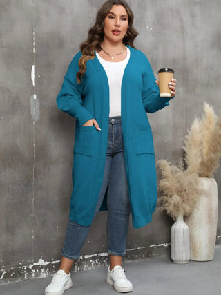Plus size long sleeve pocketed teal cardigan with open front and ribbed texture modeled with casual outfit