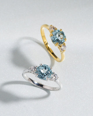 Blue topaz three stone ring with simulated diamonds in 18k gold vermeil and sterling silver settings