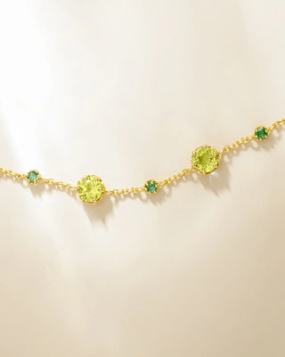 Emerald and peridot bracelet in 18k gold vermeil with round cut gemstones on adjustable chain