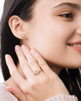 Blue Topaz Three Stone Ring in 18k Gold Vermeil on woman's hand, featuring sky blue topaz and simulated diamonds