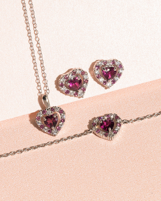 Red Heart Rhodolite Garnet stud earrings and pendant set in sterling silver with heart-shaped raspberry red gemstones and simulated diamonds