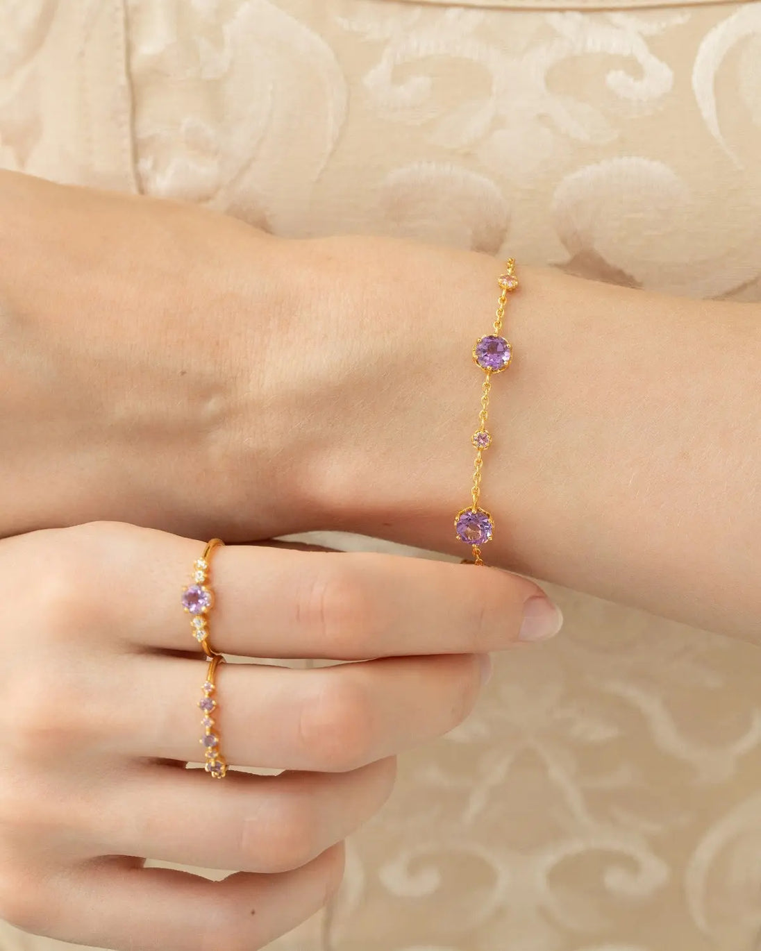 Lavender Amethyst Five Stone Ring in 18k gold vermeil with natural round cut gemstones and simulated diamonds on hand model