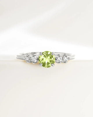 Sterling silver peridot ring with round cut green gemstone and small simulated diamonds for everyday wear