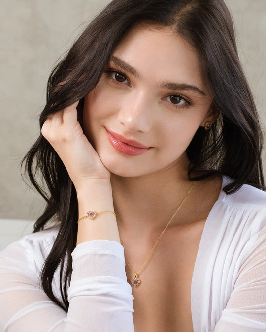 woman wearing purple heart lavender amethyst pendant necklace and bracelet set in 18k gold vermeil