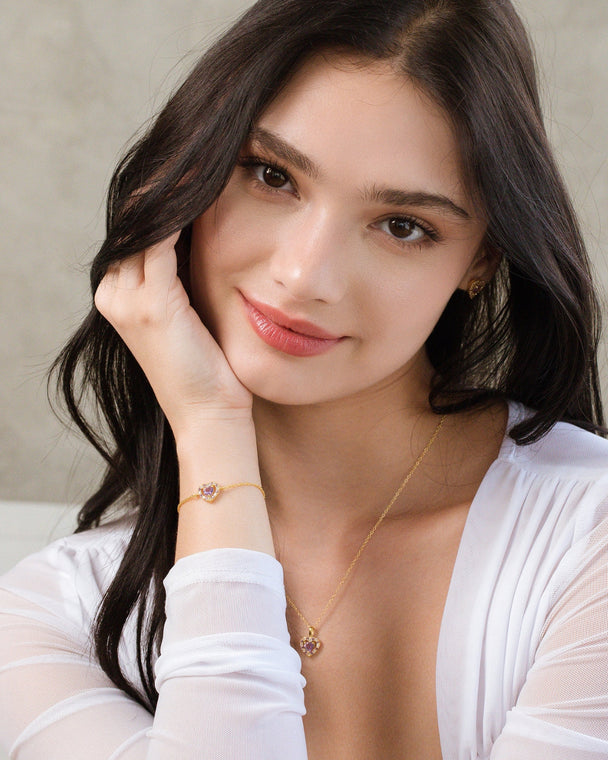 woman wearing purple heart lavender amethyst pendant necklace and bracelet set in 18k gold vermeil