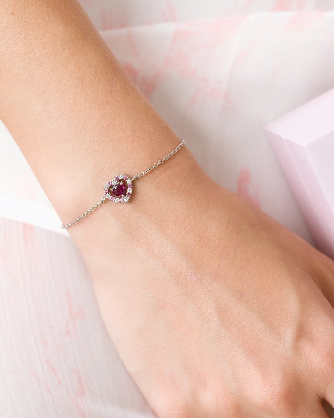 Red heart rhodolite garnet bracelet in sterling silver with adjustable chain and simulated diamonds
