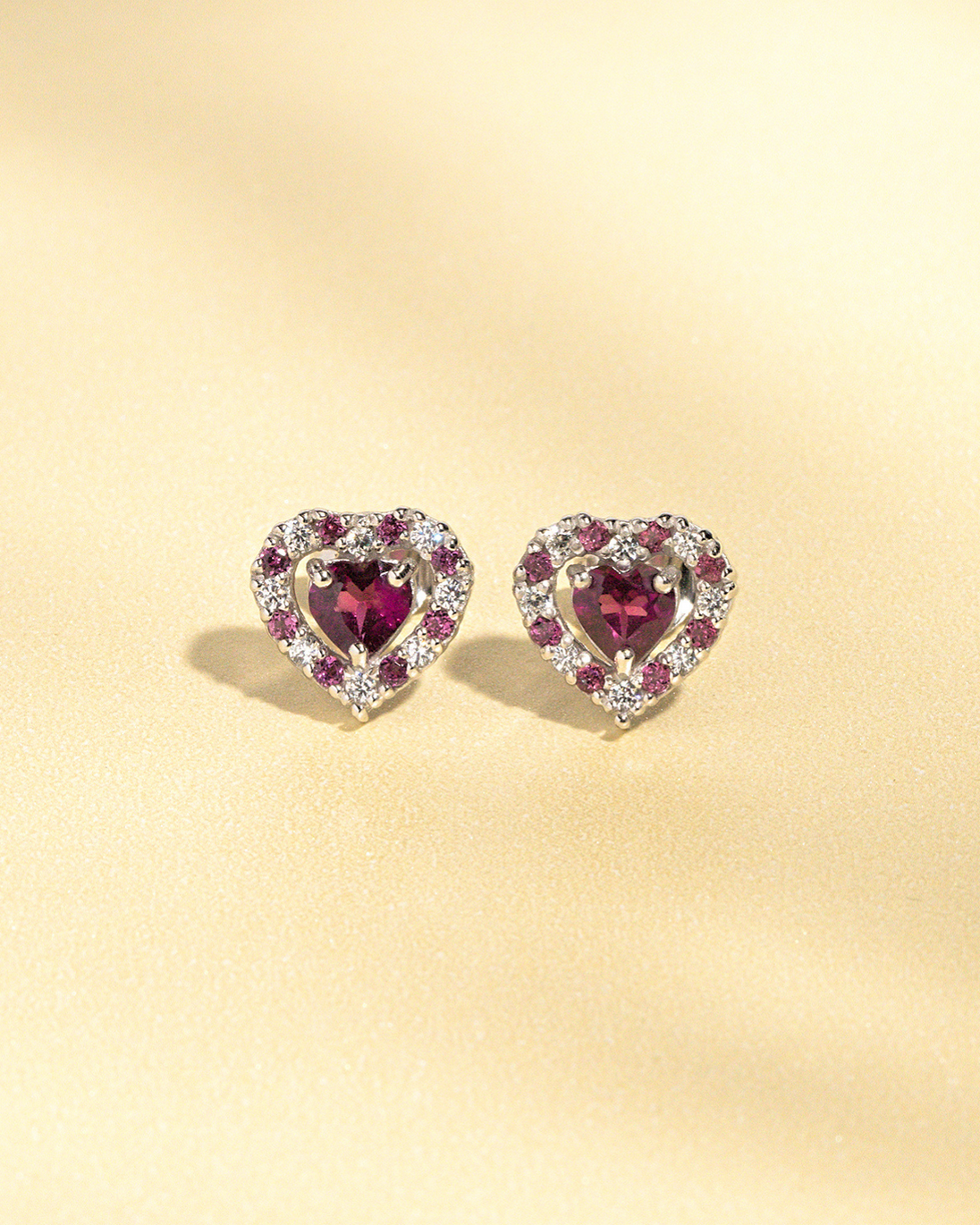 Red heart rhodolite garnet stud earrings in sterling silver with simulated diamonds
