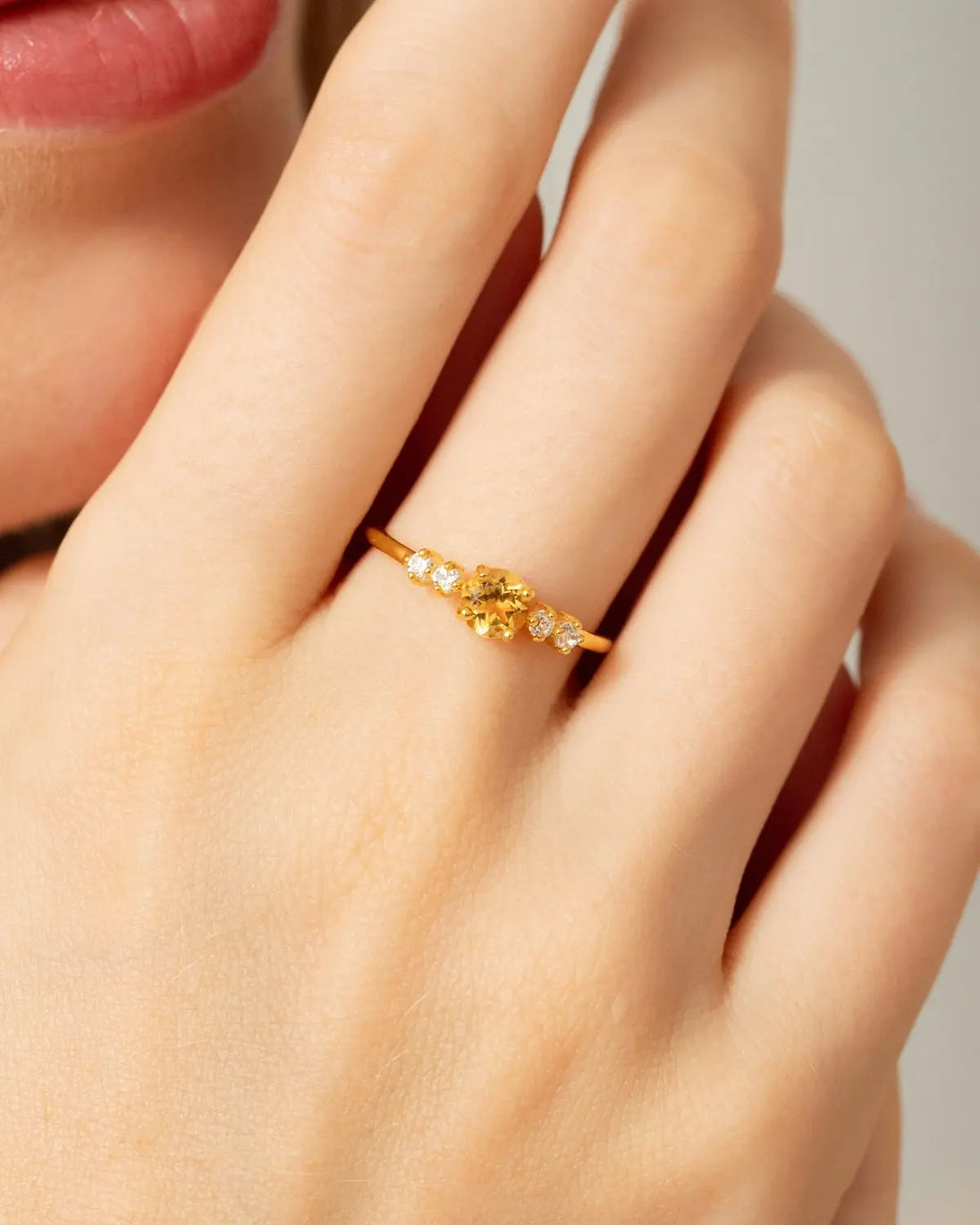 Citrine Five Stone Ring with natural round citrine and simulated diamonds in 18k gold vermeil on hand model