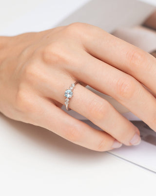 Close-up of hand wearing sterling silver blue topaz ring from Blue Topaz Everyday Jewellery Set
