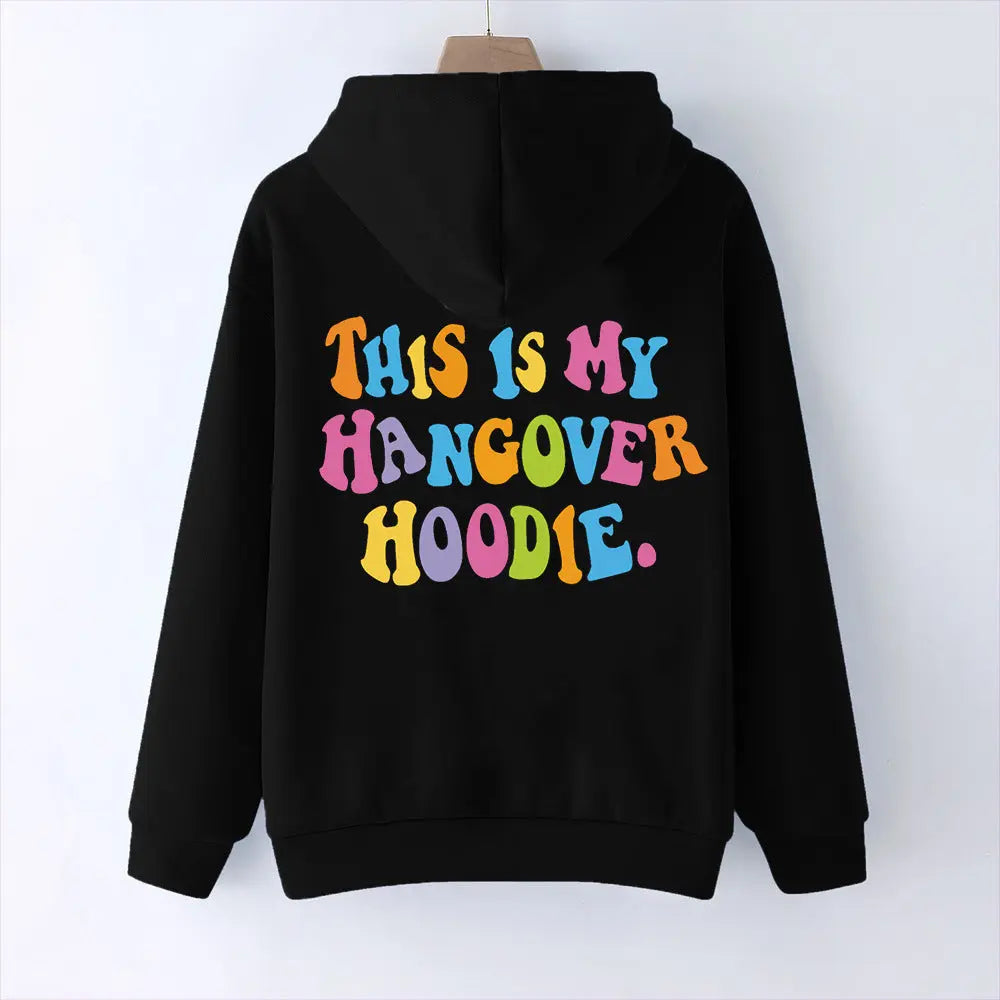Black oversized women's hoodie with colorful "THIS IS MY HANGOVER HOODIE" back print and drop shoulder design