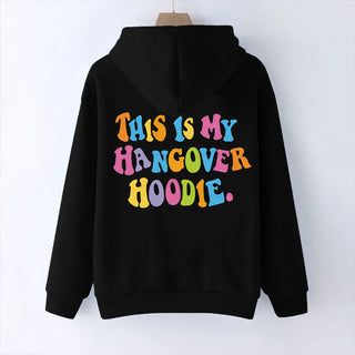 Black oversized women's hoodie with colorful "THIS IS MY HANGOVER HOODIE" back print and drop shoulder design