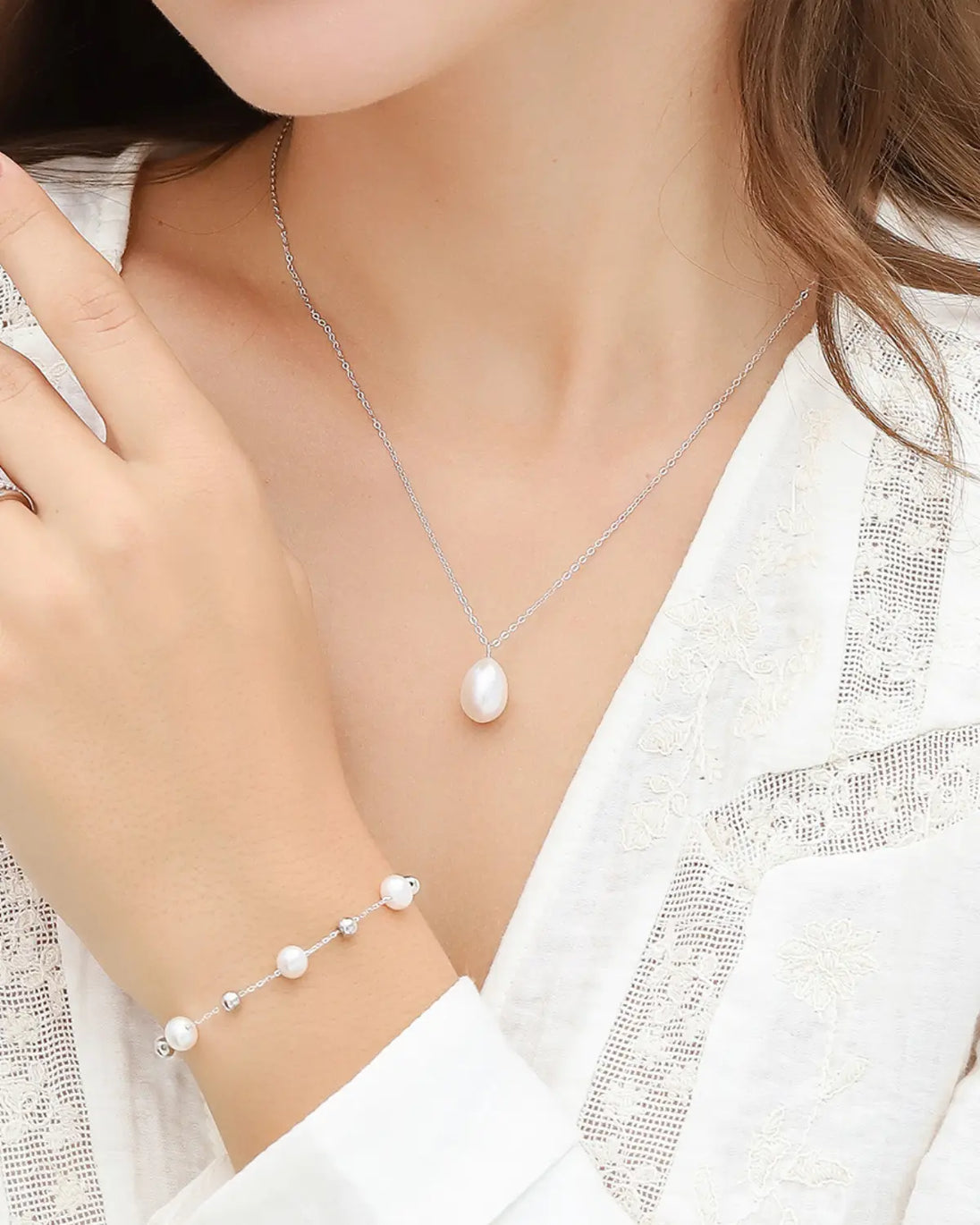 Sterling silver pearl bracelet with natural freshwater pearls and silver balls on adjustable chain