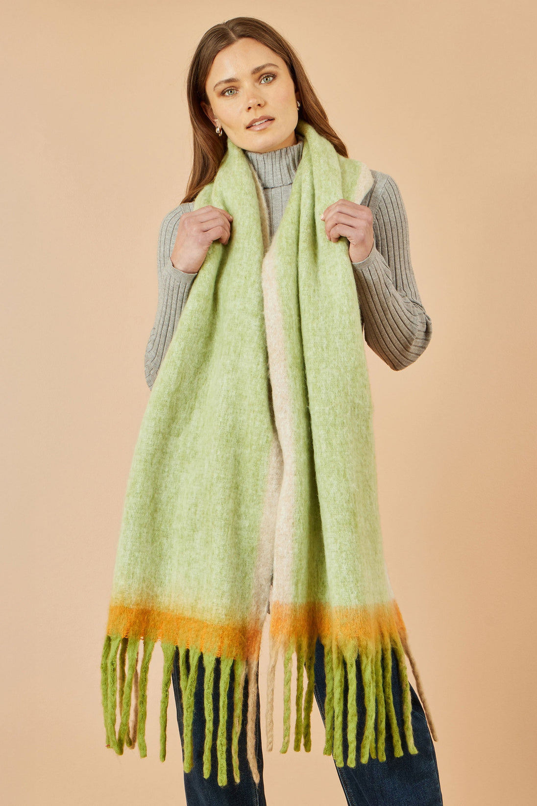 Yumi Green colour block scarf in soft polyester with fringe detail worn by model