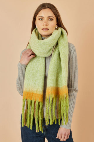 Yumi Green lightweight green colour block scarf with fringe on model