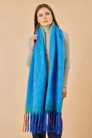 Woman wearing Yumi Blue Colour Block Scarf made of 100% polyester with fringe details