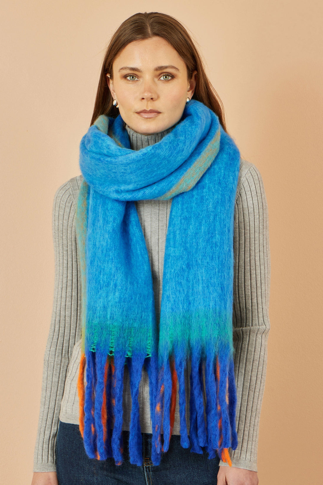 Yumi Blue Colour Block Scarf in vibrant blue with color block design and fringe details worn by woman