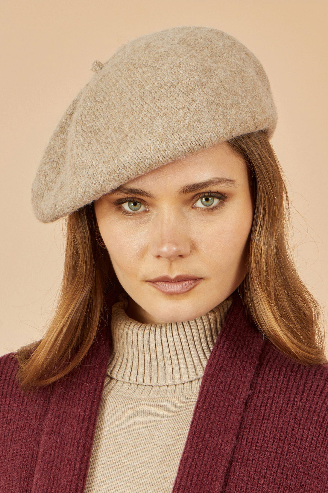 Yumi Oatmeal Soft Knitted Beret worn by woman with long brown hair and neutral makeup