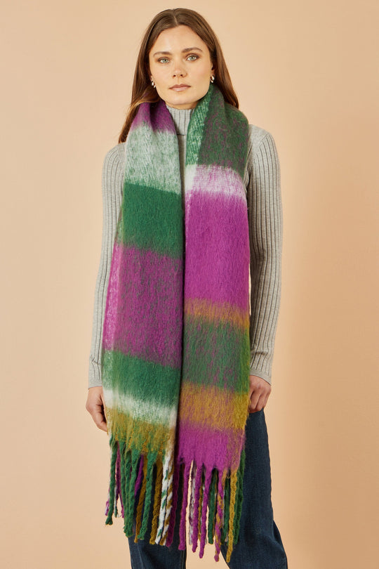 Yumi Green and Purple Check Soft Scarf worn by woman with fringe edges