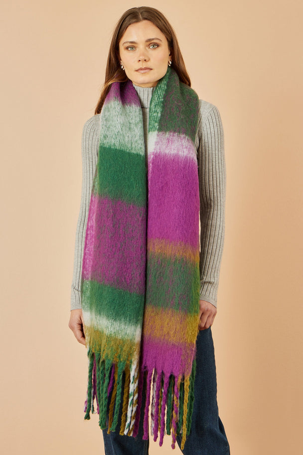 Yumi Green and Purple Check Soft Scarf worn by woman with fringe edges