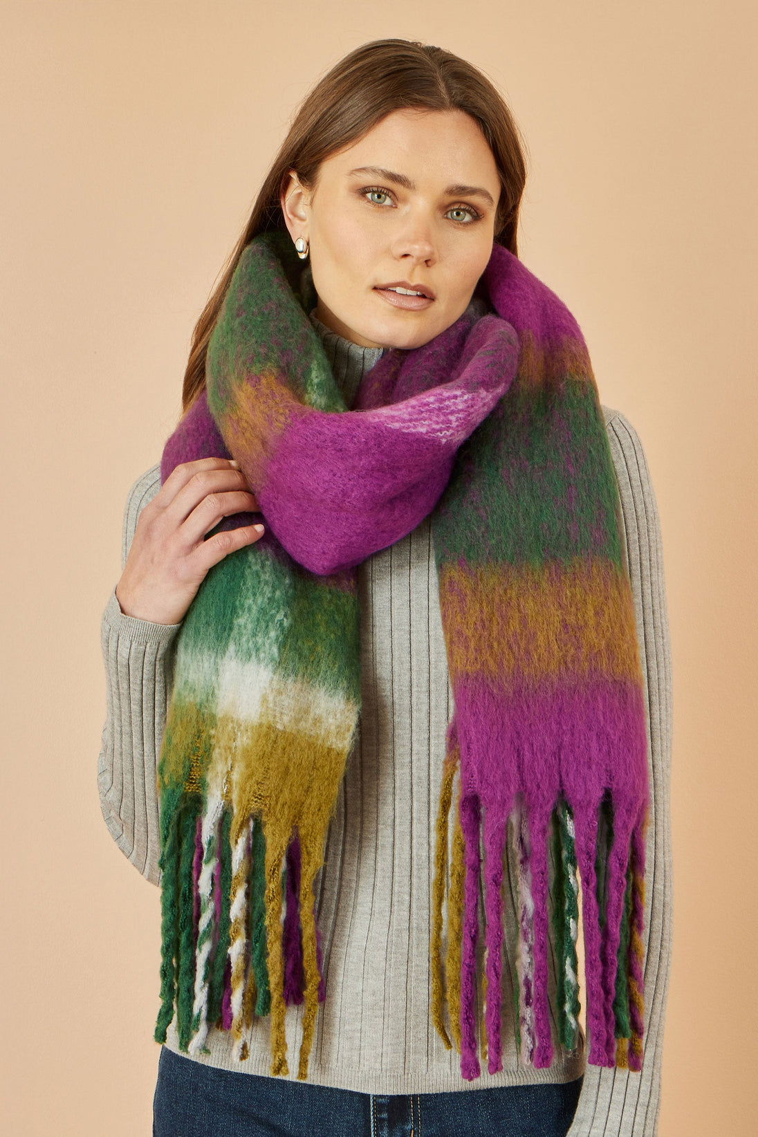 Yumi Green And Purple Check Soft Scarf wrapped around woman wearing gray sweater