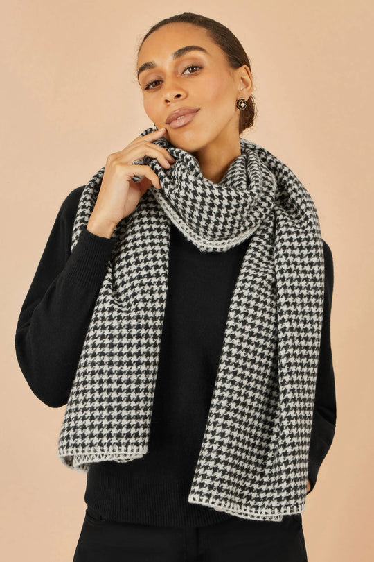 Yumi Black Dog Tooth Scarf with stitch detail worn by woman