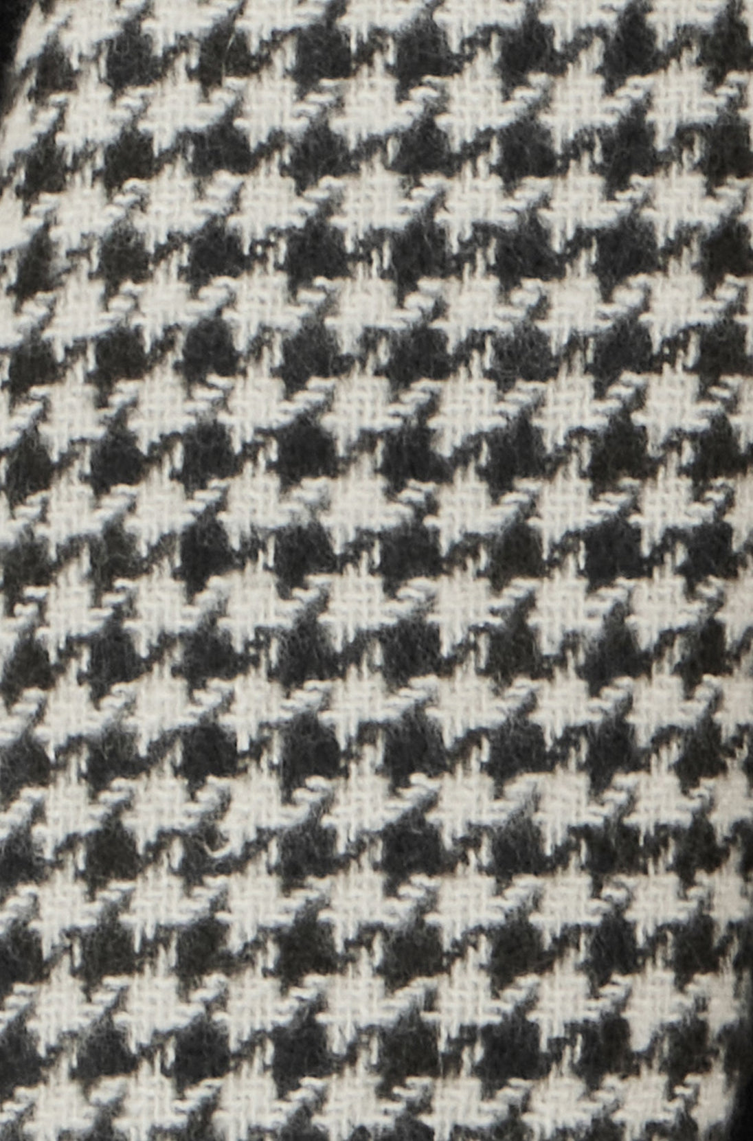 Yumi Black Dog Tooth Scarf with detailed stitch pattern in black and white polyester fabric