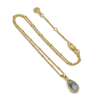 Simi teardrop gemstone pendant necklace with labradorite set in 22K gold on recycled brass chain