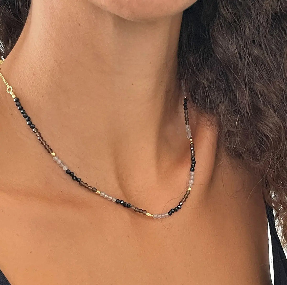 Milos Mixed Gemstone Beaded Necklace with Black Onyx, Smoky Quartz, Labradorite on 22K Gold recycled brass, adjustable length, worn on neck