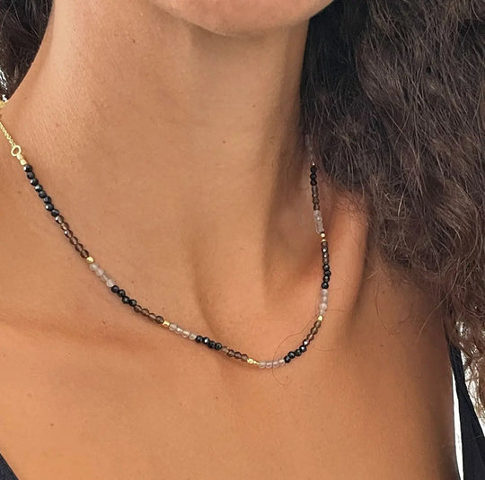 Milos Mixed Gemstone Beaded Necklace with Black Onyx, Smoky Quartz, Labradorite on 22K Gold recycled brass, adjustable length, worn on neck