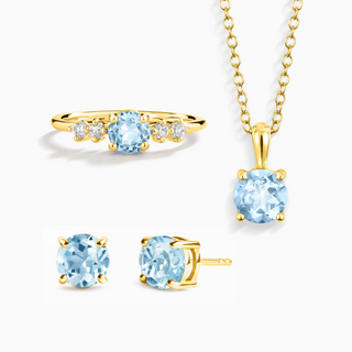 Blue topaz jewelry set with necklace, ring, and stud earrings in 18k gold vermeil