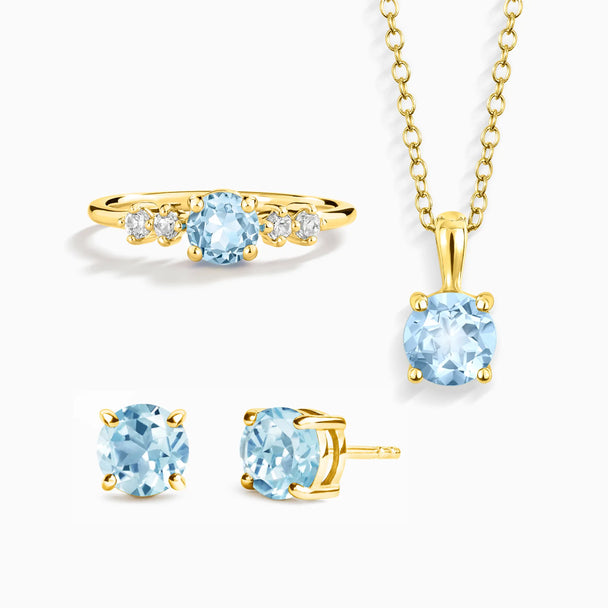 Blue topaz jewelry set with necklace, ring, and stud earrings in 18k gold vermeil