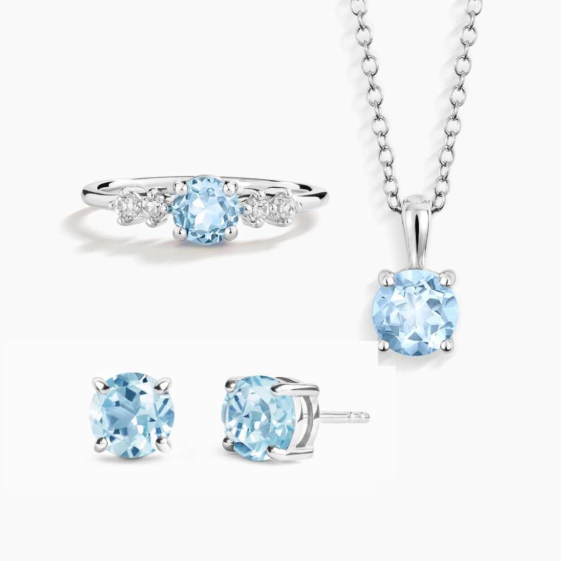 Blue topaz everyday jewellery set with ring, necklace, and stud earrings in sterling silver