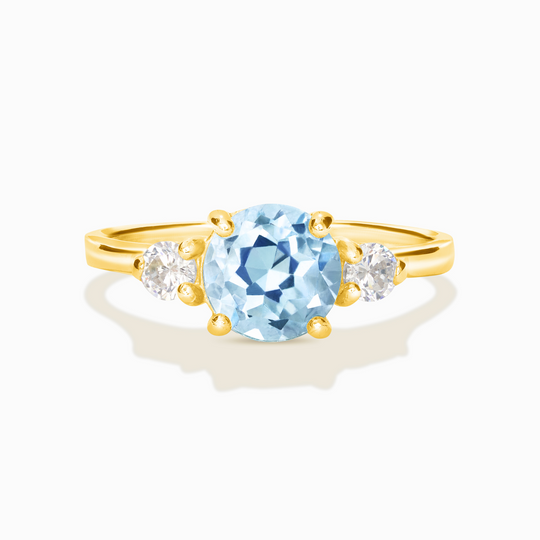 Blue topaz three stone ring with round-cut gemstone and simulated diamonds in 18k gold vermeil setting