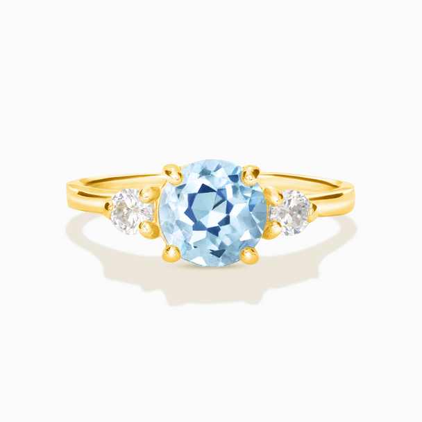 Blue topaz three stone ring with round-cut gemstone and simulated diamonds in 18k gold vermeil setting