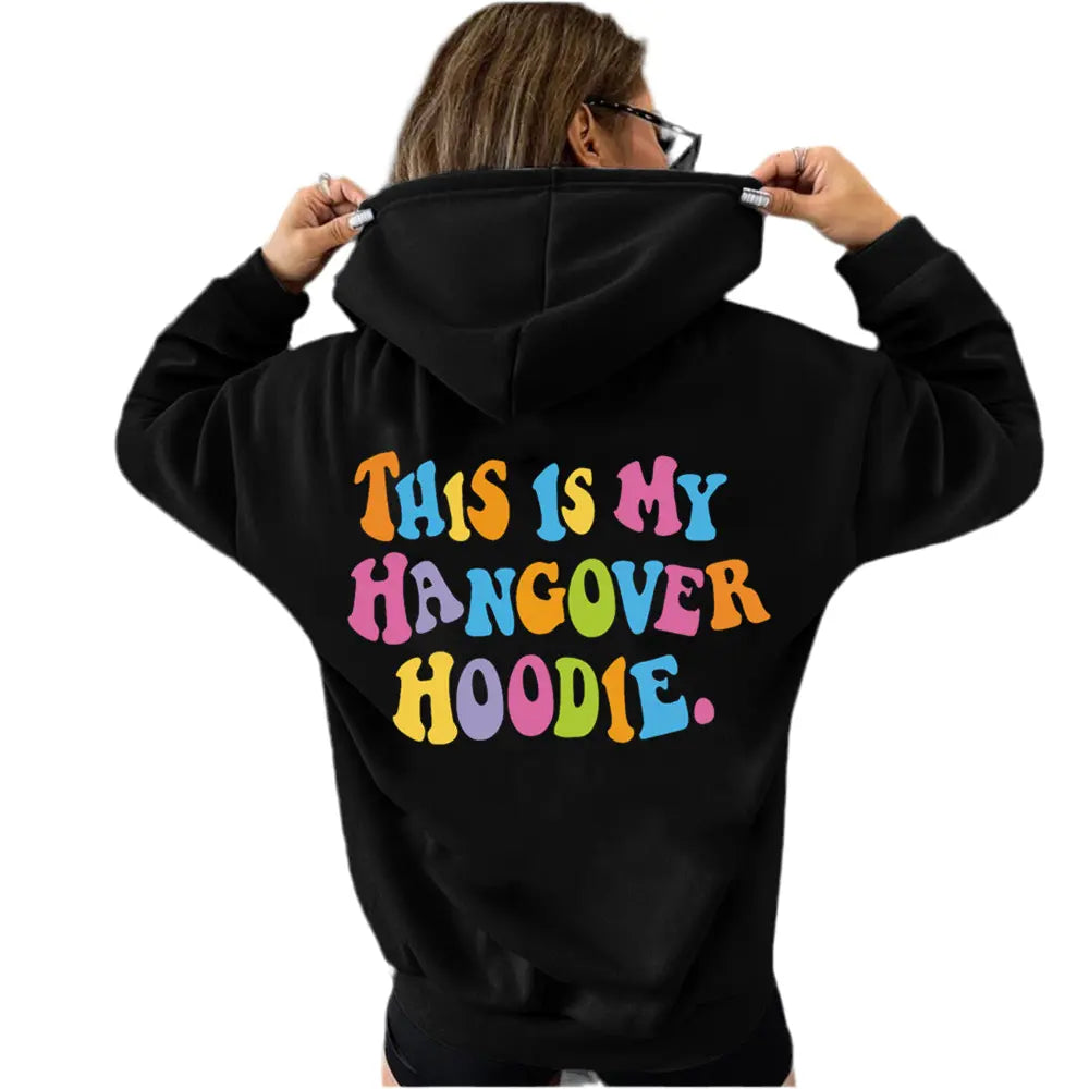 Women’s oversized black hoodie with colorful "THIS IS MY HANGOVER HOODIE" back print and drop shoulder design