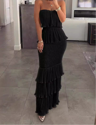 Strapless ruffle maxi dress in black with elegant flowy design.