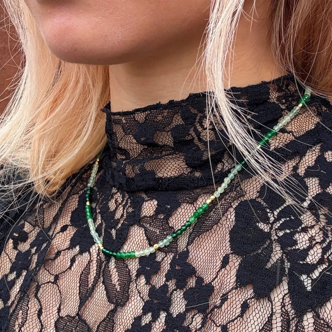 Milos Mixed Gemstone Beaded Necklace with Prehnite, Moss Agate, and Green Aventurine on 22K gold recycled brass worn on lace top