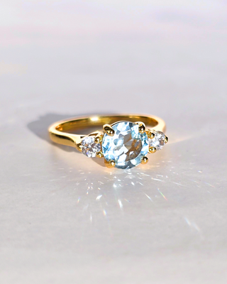 Blue Topaz Three Stone Ring with sky blue topaz and simulated diamonds in 18k gold vermeil