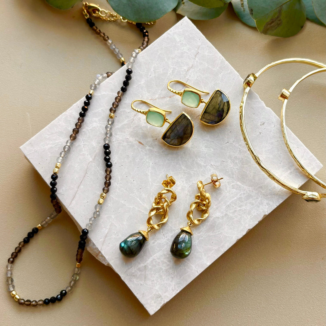 Moirai Double Twisted Loops Earrings with labradorite gemstone and 22K gold on recycled brass handcrafted design